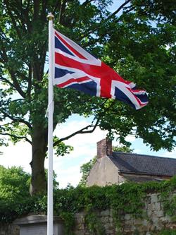 hand sewn union jack flag flying from a flagpole
