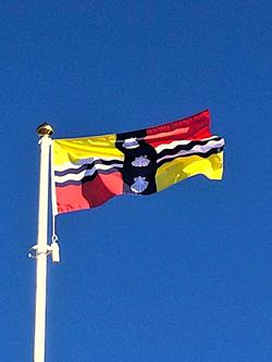 Bedfordshire county flag flying on a sunny day
