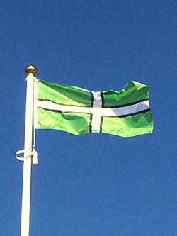 Devon County Flag flying on a sunny day