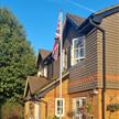 garden flagpole in the UK with a union jack flag