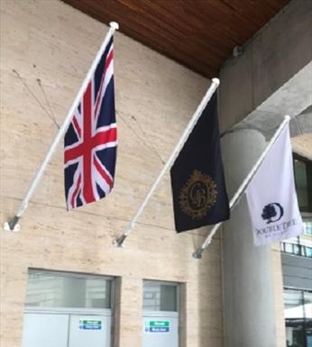 three flagpoles with white finials